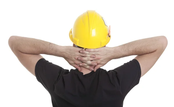 A young carpenter in front of a white background — Stock Photo, Image