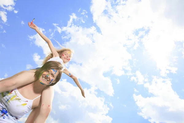 A little blond girl with paint on the face — Stock Photo, Image