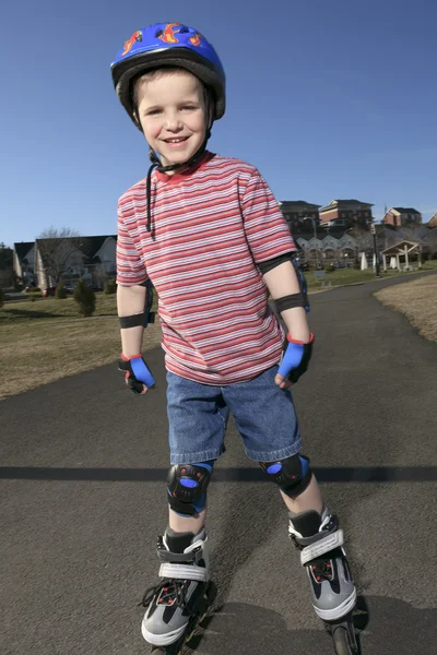 Boy having fun, rollerblading outdoor on a sunny summer day — Stock Photo, Image