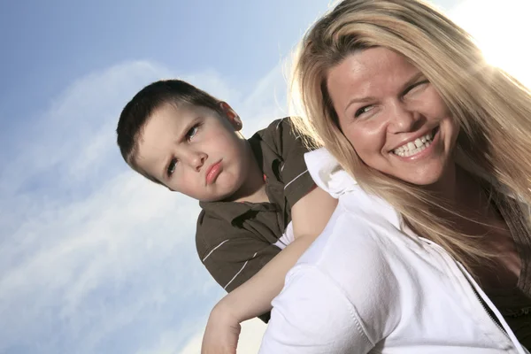 A portrait of a boy with is mother outside — Stock Photo, Image