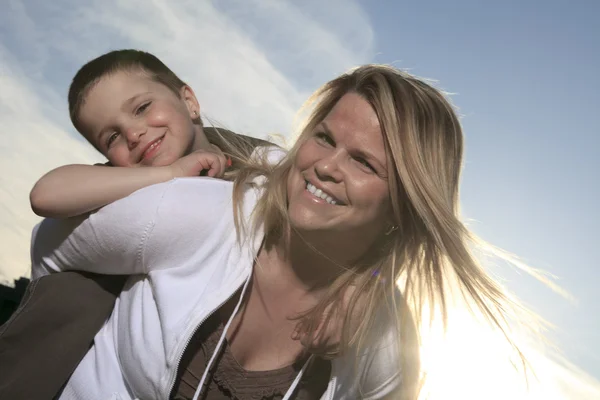 A portrait of a boy with is mother outside — Stock Photo, Image