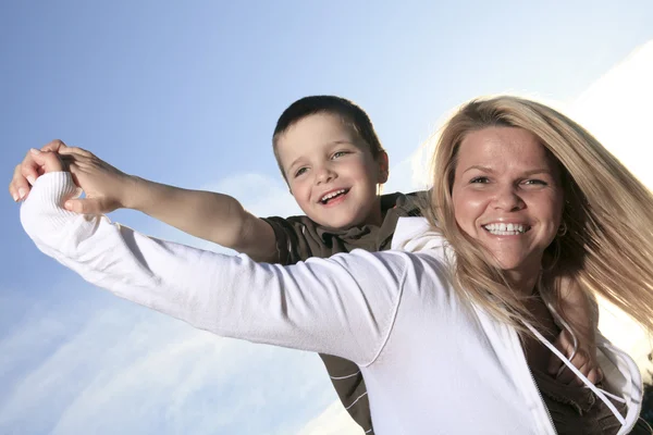 A portrait of a boy with is mother outside — Stock Photo, Image