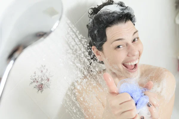 Shower woman. Happy smiling woman washing shoulder showering in — Stock Photo, Image