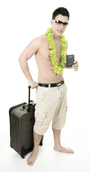 Portrait of a man smiling leaning on a suitcase holding a passpo — Stock Photo, Image