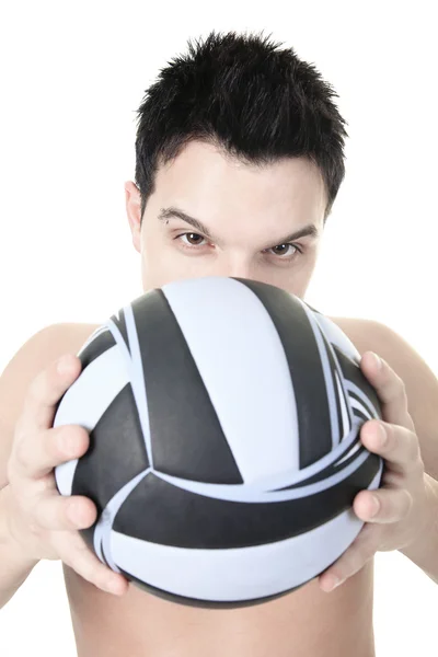 Um atleta de voleibol com bola no estúdio — Fotografia de Stock