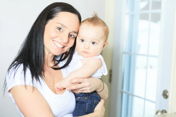 Happy 8 month old baby boy with mother — Stock Photo, Image