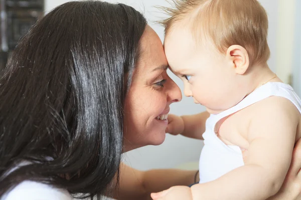 Happy 8 month old baby boy with mother — Stock Photo, Image