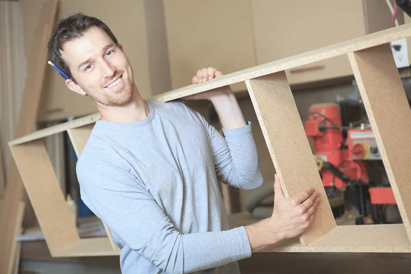 A carpenter working hard at the worksop — Stock Photo, Image