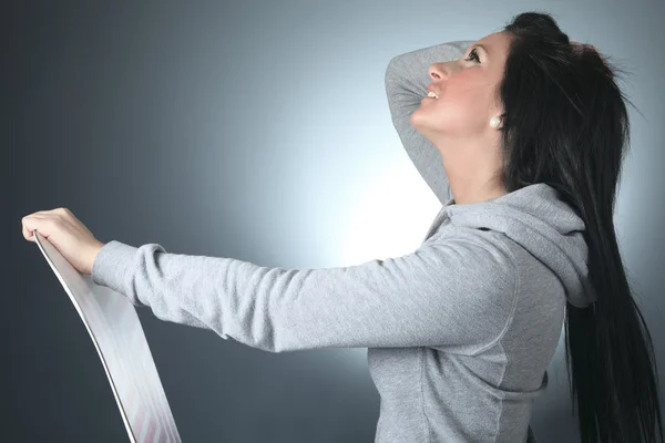 Beautiful woman with a snowboard in studio — Stock Photo, Image