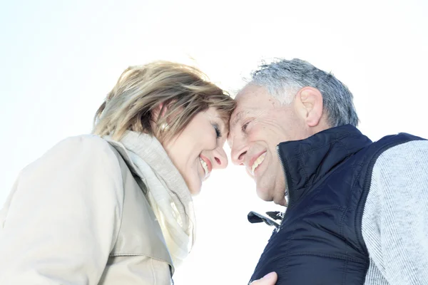 Portrait of happy senior couple in winter season — Stock Photo, Image