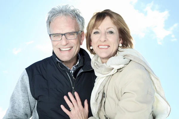 Portrait of happy senior couple in winter season — Stock Photo, Image