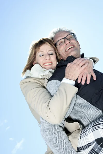 Portrait of happy senior couple in winter season — Stock Photo, Image