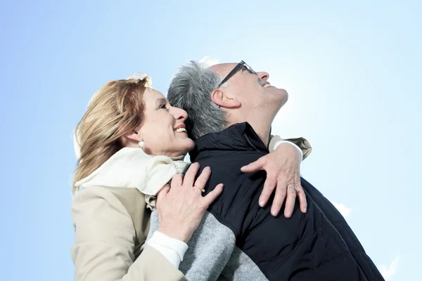 Portrait of happy senior couple in winter season — Stok Foto