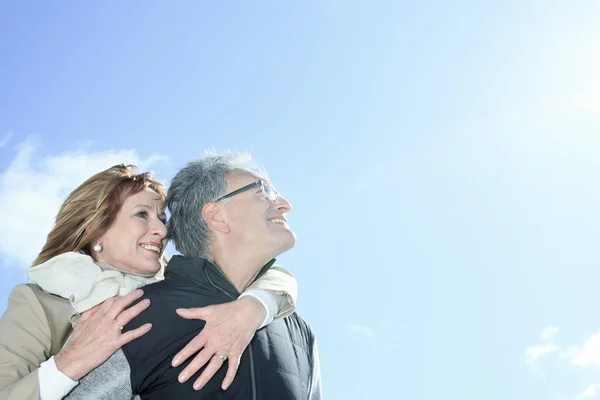 Portrait of happy senior couple in winter season — Stock Photo, Image