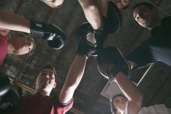 Boxing aerobox women group with personal trainer man at fitness