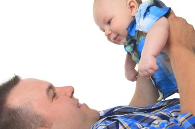 A Cute Caucasian baby holding by his father. clipart