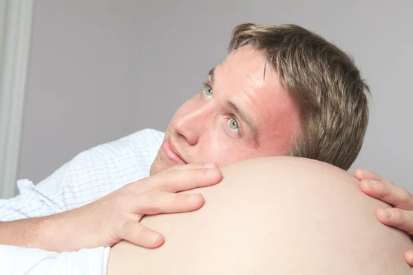 Pregnant woman belly with future father look — Stock Photo, Image