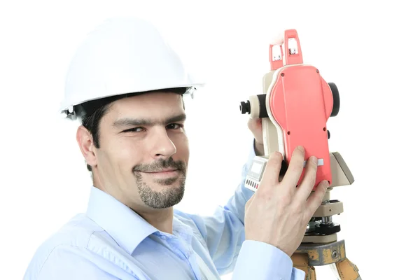 Portrait of men surveyor working with theodelite. Isolated on wh — Stock Photo, Image