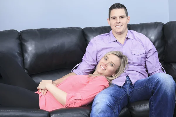 A Couple at home relaxing in sofa — Stock Photo, Image