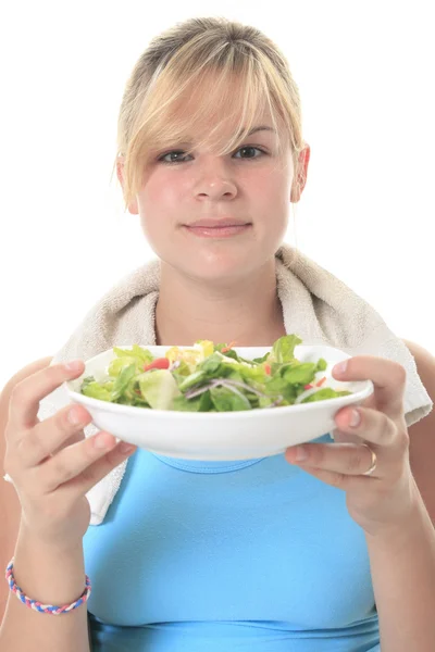 Een zwangere vrouw dragen in opleiding met een salade — Stockfoto