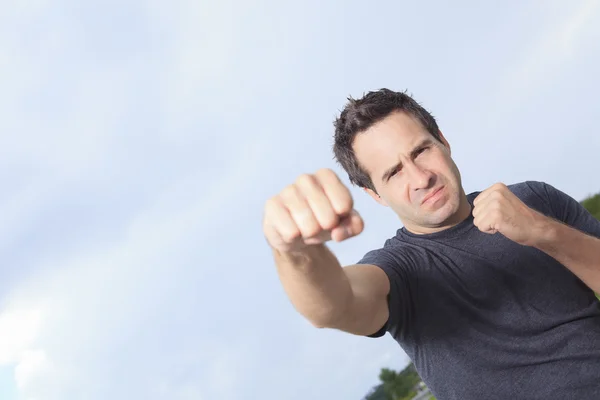 A portrait of an angry man who looks like he is up to start a fi — Stock Photo, Image