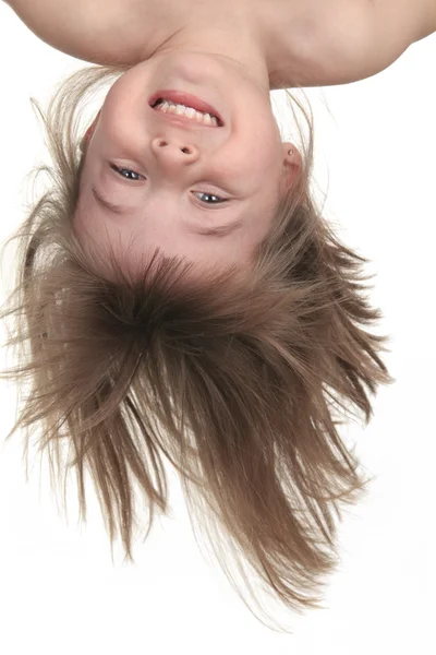 A Young girl upside down in studio white background — Stock Photo, Image