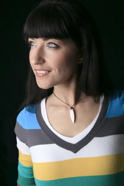 A portrait of a woman over a black background — Stock Photo, Image