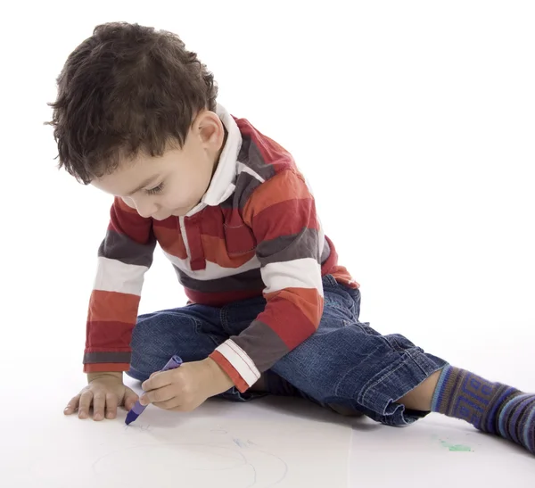 白い床の上を描く少年 — ストック写真
