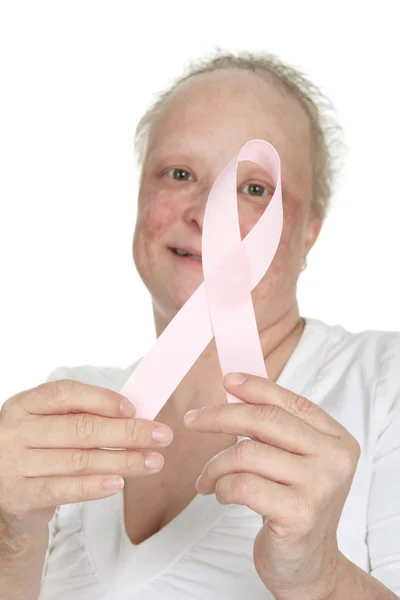 A woman holding a breast cancer logo — Stock Photo, Image