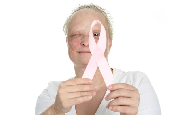 A woman holding a breast cancer logo — Stock Photo, Image