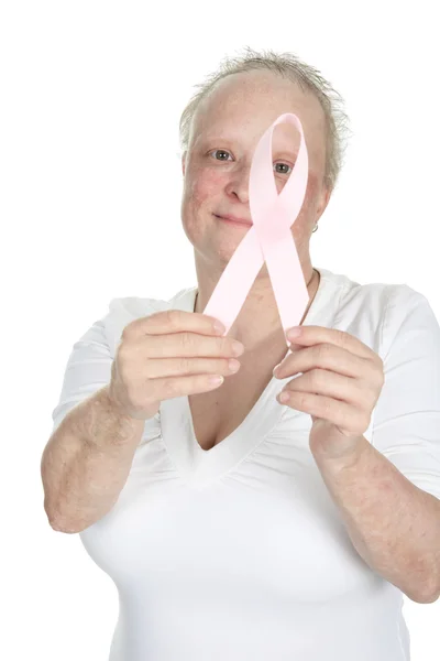 A woman holding a breast cancer logo — Stock Photo, Image