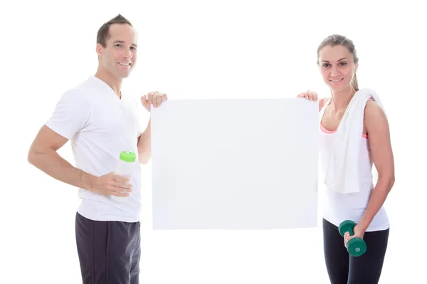 Dois adultos de treinamento segurando um papelão no estúdio . — Fotografia de Stock