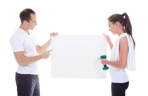 Two training adult holding a cardboard in studio. — Stock Photo, Image