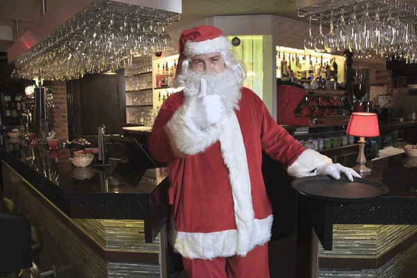 A Santa claus looking at camera in the bar — Stock Photo, Image