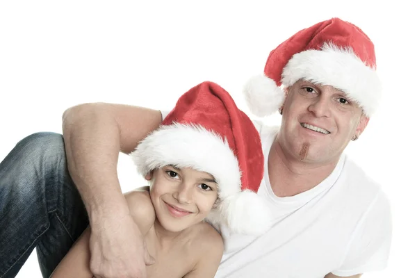 Menino de Natal com é pai dentro de um estúdio fundo branco — Fotografia de Stock