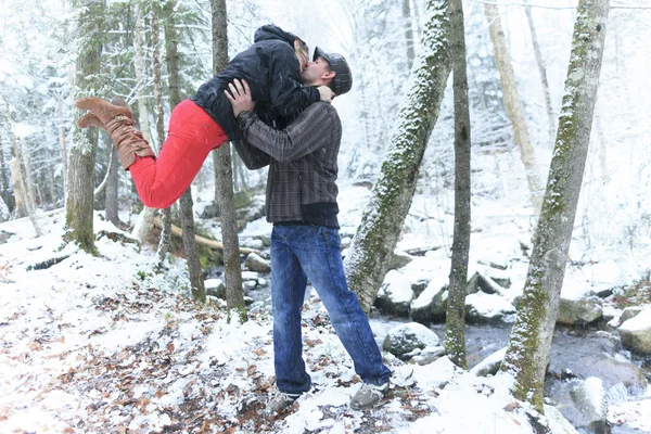A couple having fun in the park, in winter holidays — Stock Photo, Image