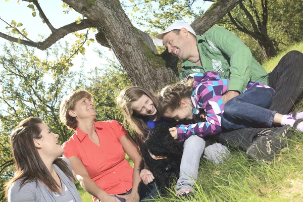 Family throw autumnal leaves — Stock Photo, Image