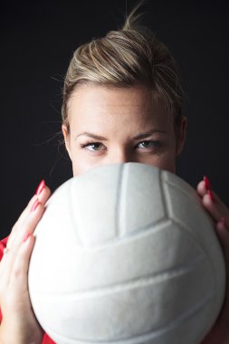 young, beauty volleyball player. Isolated on black in studio clipart