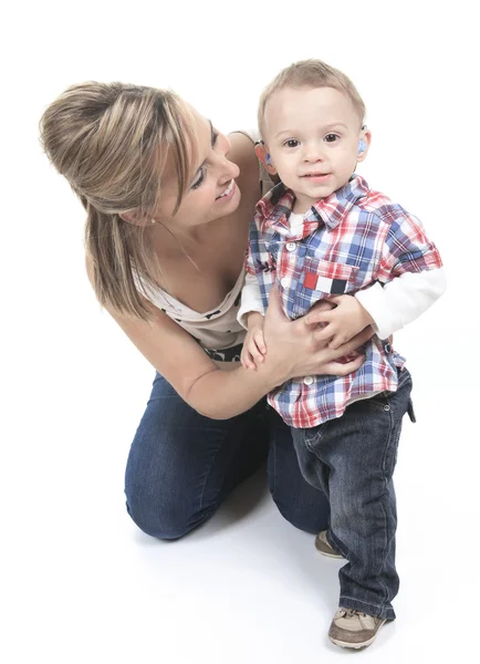 Mother with son. The kid have a Hearing Aids. — Stock Photo, Image