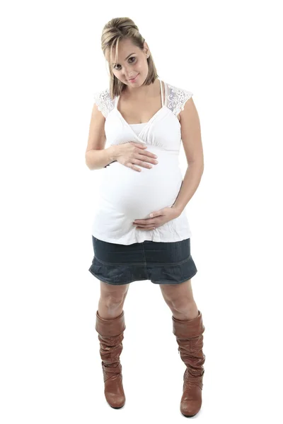 Young pregnant woman against white background — Stock Photo, Image