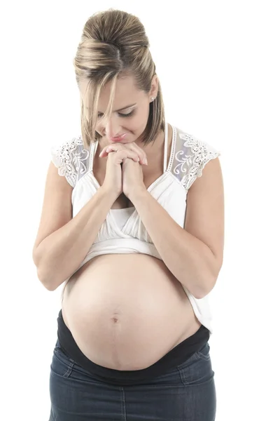 Young pregnant woman against white background — Stock Photo, Image