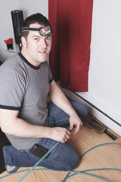 A ventilation cleaner man at work with tool — Stock Photo, Image