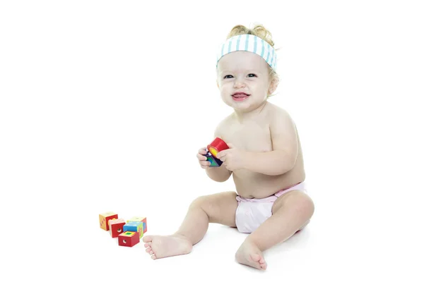 A blond baby Play block in studio — Stock Photo, Image