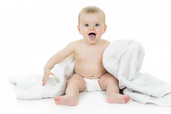 Dulce niño sentado en el estudio fondo blanco — Foto de Stock