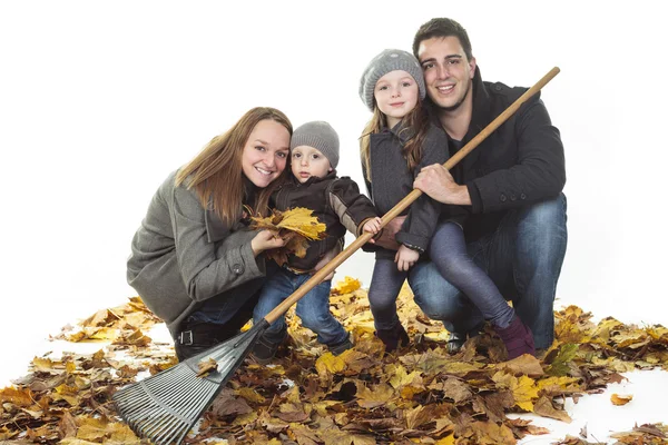 A happy autumn family with lead on studio white background — Stock Photo, Image