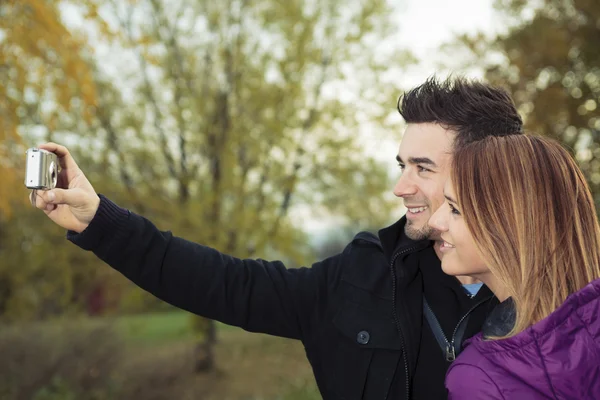 A Young happy couple in autumn season — Stock Photo, Image