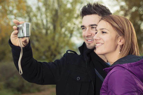 A Young happy couple in autumn season — Stock Photo, Image