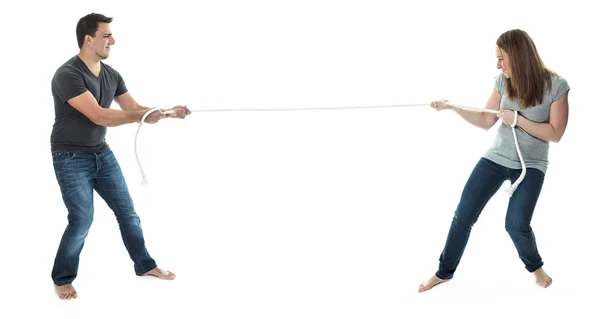 A couple on studio white background pull the rope — Stock Photo, Image