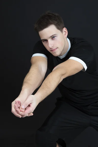 Young volleyball player on dark background — Stock Photo, Image