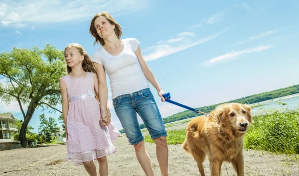 Happy family playing on the beach at the day time. — Stock Photo, Image